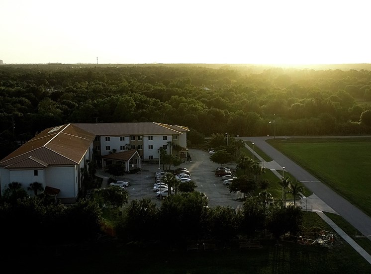 aerial view of St. John XXIII Villas surrounded by lush trees